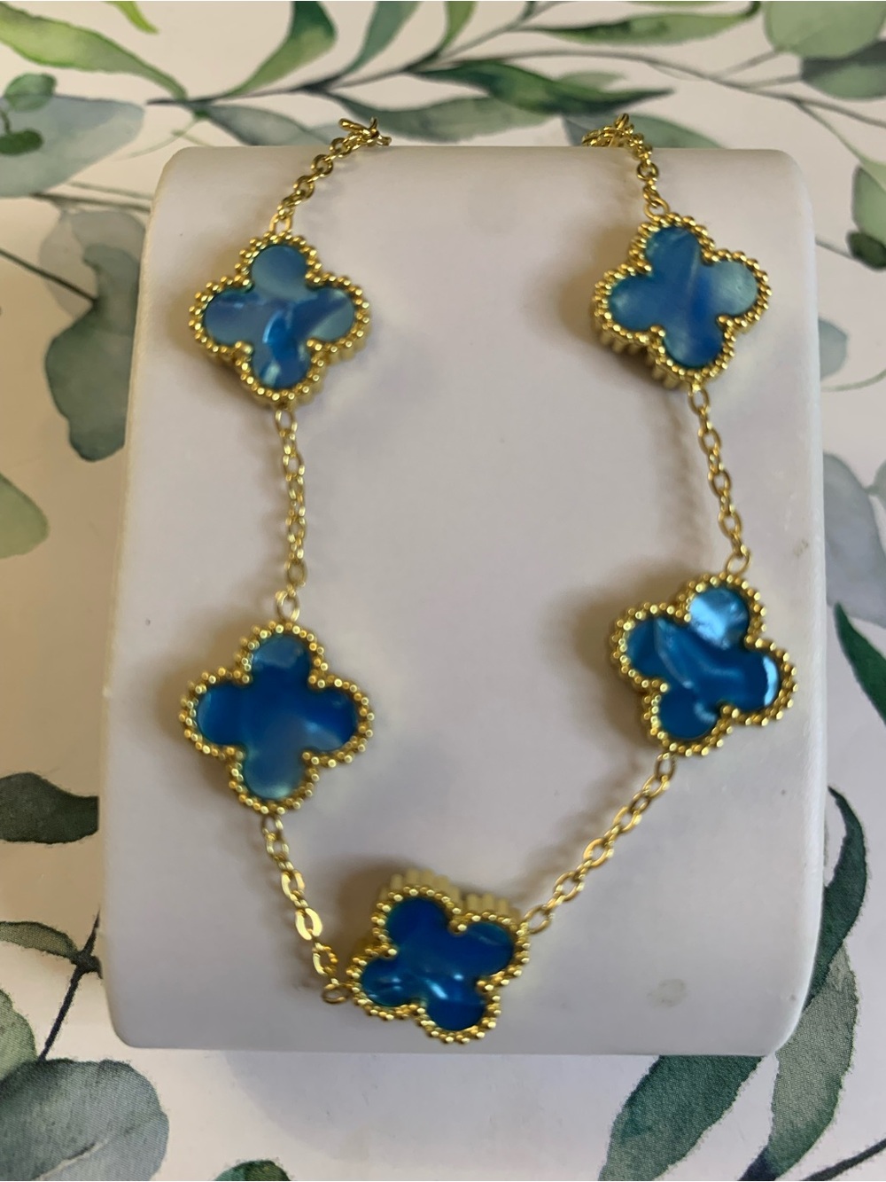 Gold Chain Necklace with Blue Clover Motifs. Stainless Steel